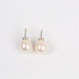 A pair of 18 ct white gold, large pearl and diamond drop earrings