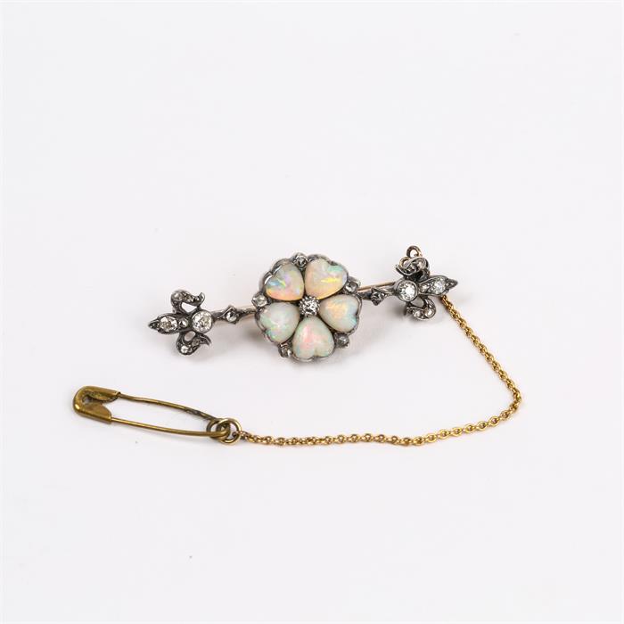 An antique, yellow gold, diamond and natural opal, flower-head, pin brooch