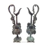 A pair of antique bronze metal urns, ornately decorated with elephant heads. Condition: good. H: