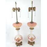 A pair of glass table lamps with gilt metal fittings