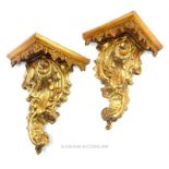 A pair of antique carved gilt-wood corner wall sconces