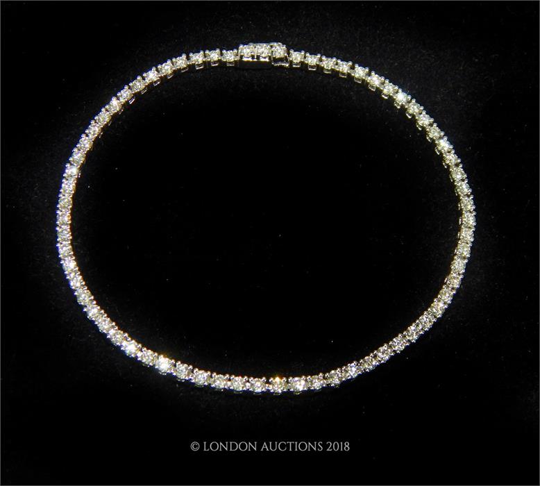 A brand-new, 18 ct white gold and diamond tennis bracelet (2.5 carats approx)