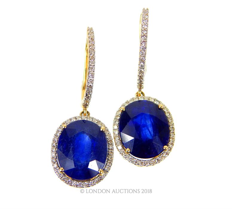 A boxed pair of 8 ct white gold, sapphire and diamond drop earrings