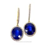 A boxed pair of 8 ct white gold, sapphire and diamond drop earrings