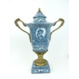 A large, Louix XVI style, porcelain blue and white urn and cover