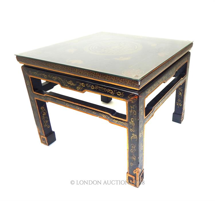 A circa 1900, Chinese lacquered and gilt low table with glass top - Image 2 of 2