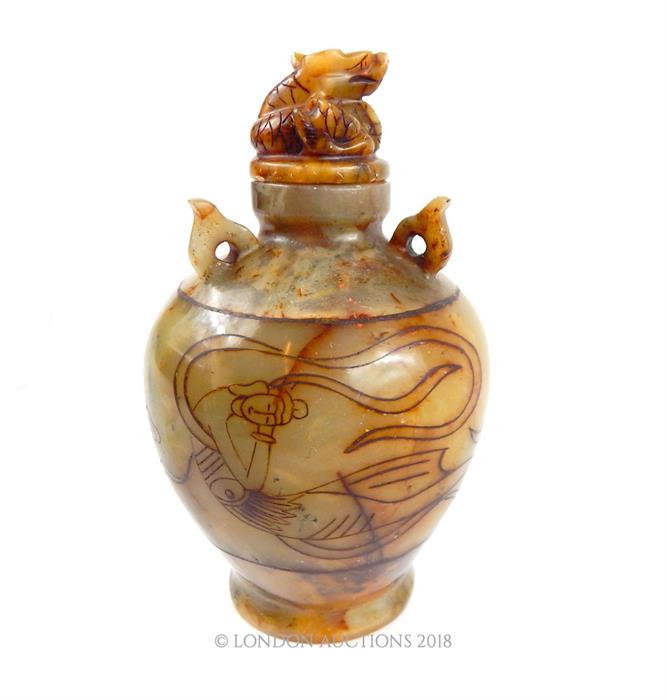 A large, oriental, quartz, jar and cover