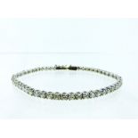 A boxed, 18 ct white gold, diamond line bracelet (4.37 carats total)