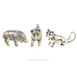 Three silver figures of a dog, a cat and a boar