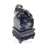 Carved black and white Chinese soapstone seal of a dragon