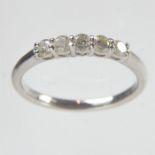 An 18 ct white gold, 5-stone diamond ring (0.35 carats)