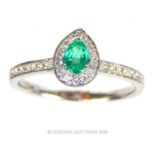 An 18 ct white gold, emerald and diamond ring (1 carat approx)