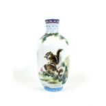 A Chinese, porcelain vase hand-painted with two squirrels