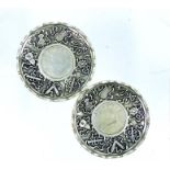 A pair of Chinese white metal dishes, inset with Chinese coins