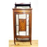 An Edwardian Rosewood and Satinwood Inlaid Music Cabinet.