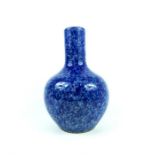 A large, Chinese, baluster vase with a mottled, deep blue glaze