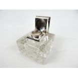 A large Victorian Glass and Silver mounted desk inkwell.