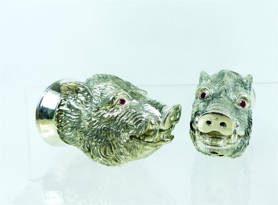 A pair of Continental (800) silver condiments in the form of boar's heads