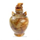 A large, Oriental, quartz, jar and cover