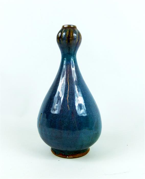 A Chinese, blue and purple, highly-glazed, bulbous vase