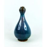 A Chinese, blue and purple, highly-glazed, bulbous vase