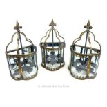 Set of three gilt metal lanterns