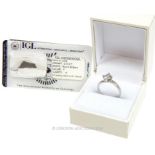 A boxed, platinum and diamond solitaire ring (0.70 carats)