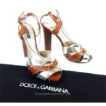 A pair of Dolce and Gabbana, brown and silver leather heels