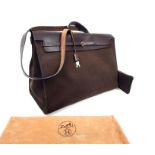 A Hermes, men's, large chocolate brown leather and fabric holdall