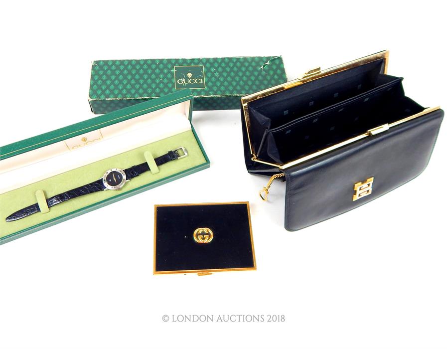 A Gucci ladies wristwatch and Gucci cigarette case