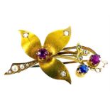 A boxed, antique, yellow gold, ruby, sapphire and diamond brooch