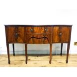 A Georgian-style, flame-mahogany, serpentine sideboard