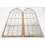 A pair of Gothic style painted metal garden mirrors