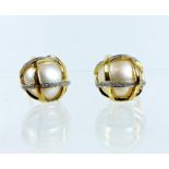 A pair of 18 ct yellow gold, pearl and diamond-studded earrings