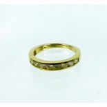 A 9 ct yellow gold, half eternity ring, set with diamonds (0.76 carats total)