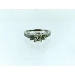 A 14 ct white gold diamond trilogy ring (1 carat), with EDR certificate