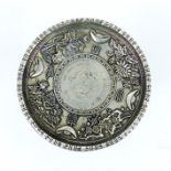 A Chinese white metal dish set with a white metal coin