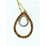 A 9 ct yellow gold citrine & diamond, drop pendant on 9 ct yellow gold chain.