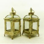 A pair of French-style, cream-painted, metal, garden lanterns
