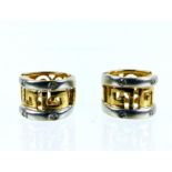 A boxed pair of 14 ct yellow and white gold, diamond stud earrings
