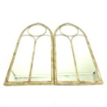 A pair of Gothic style distressed metal garden mirrors