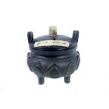 A Chinese bronze incense burner