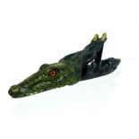 A cold-painted, bronze paper clip in the form of a crocodile