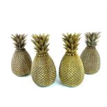 A set of four gilt resin sculptures of pineapples