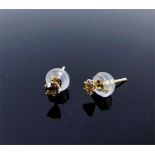 A boxed pair of 18 ct yellow gold, diamond stud earrings (0.20 carats total)