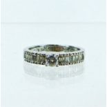 A boxed, 18 ct white gold, baguette and brilliant cut diamond ring (1 carat approx)