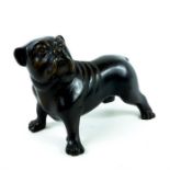 A weighty, bronzed sculpture of a bull-dog