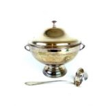 A silver plated soup tureen and a ladle