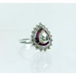 An 18 ct white gold, pear-shaped diamond and ruby cluster ring
