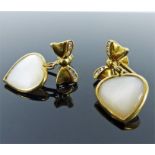 A pair of yellow gold, mother of pearl and diamond heart and bow earrings